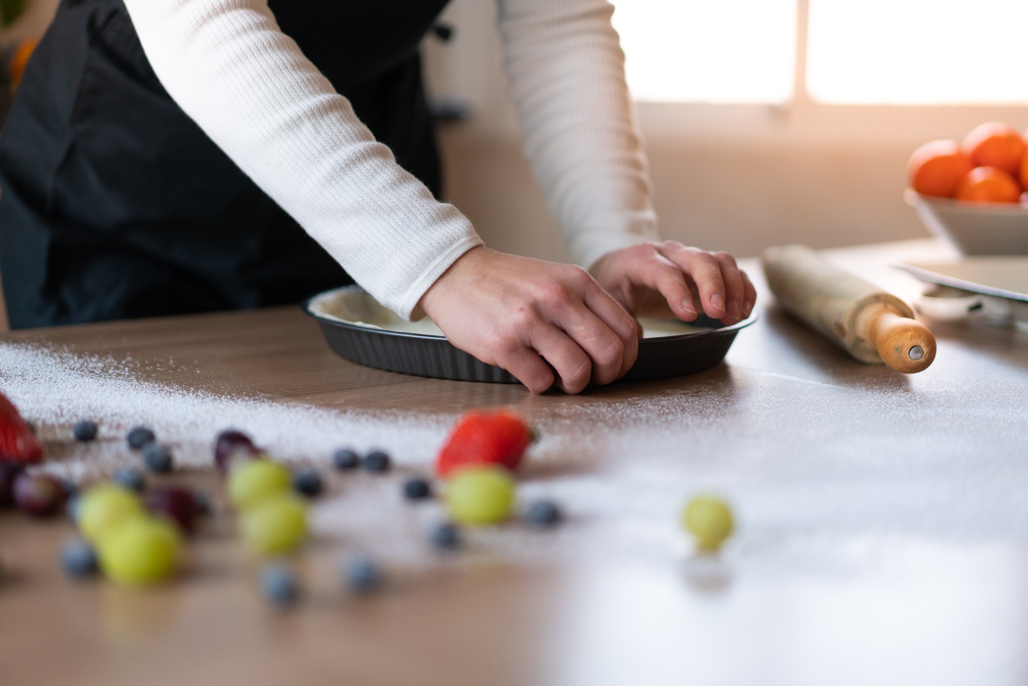 Instructor preparing local ingredients on marble counter